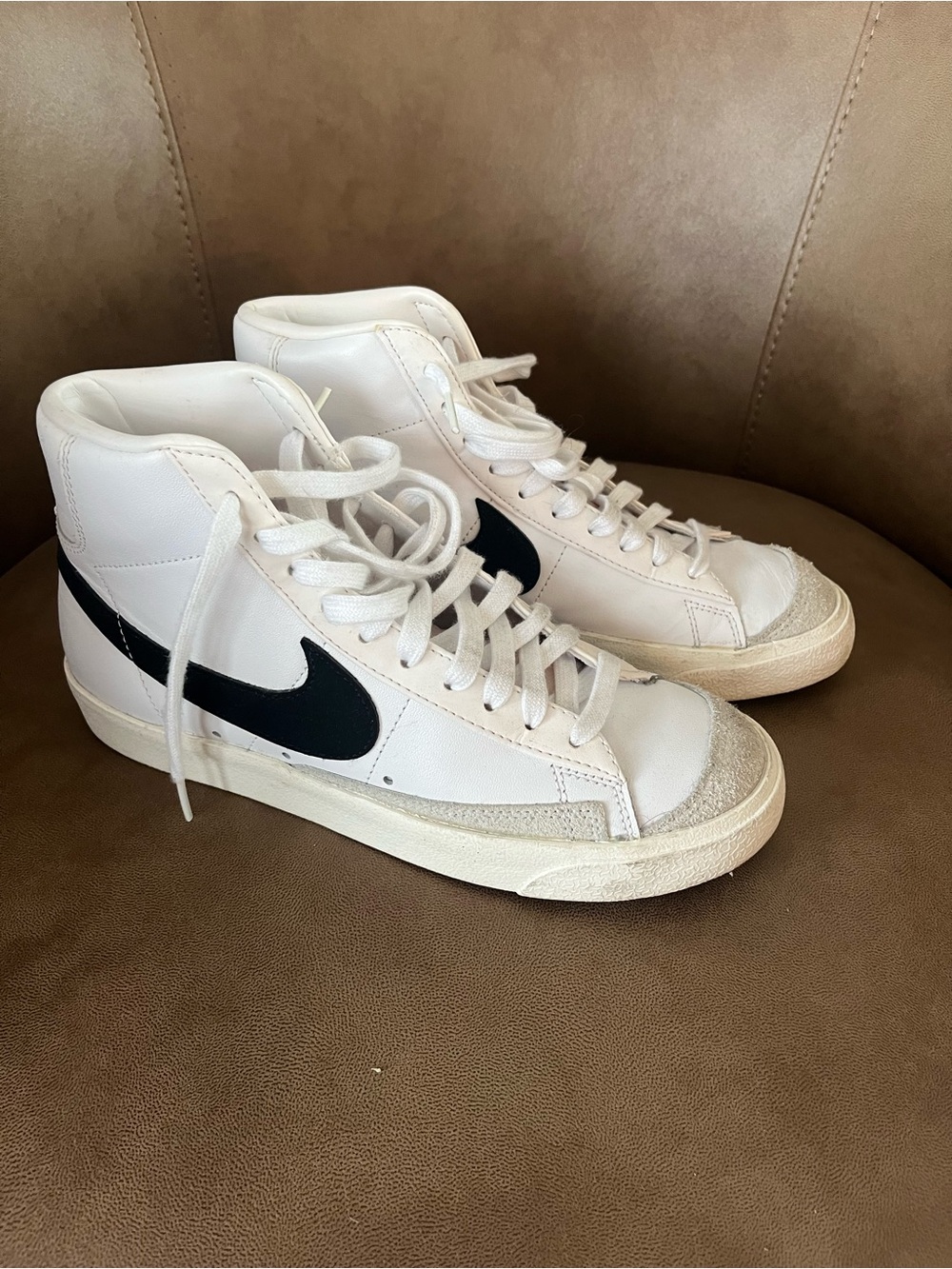 Women’s Nike White High-Top Sneakers with Black Swoosh